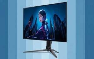 ASUS tandem OLED gaming monitor on a white desk setup with RGB accents, ultra-clear screen showing deep blacks under bright ambient lighting